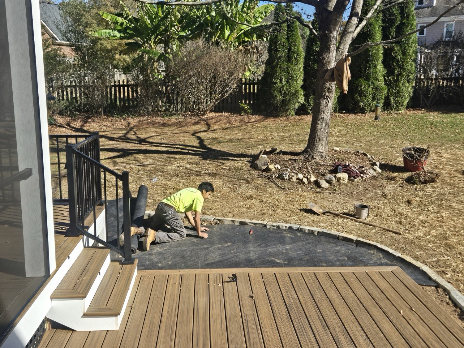 The crew at work on a backyard deck-and-patio build in South Wake.