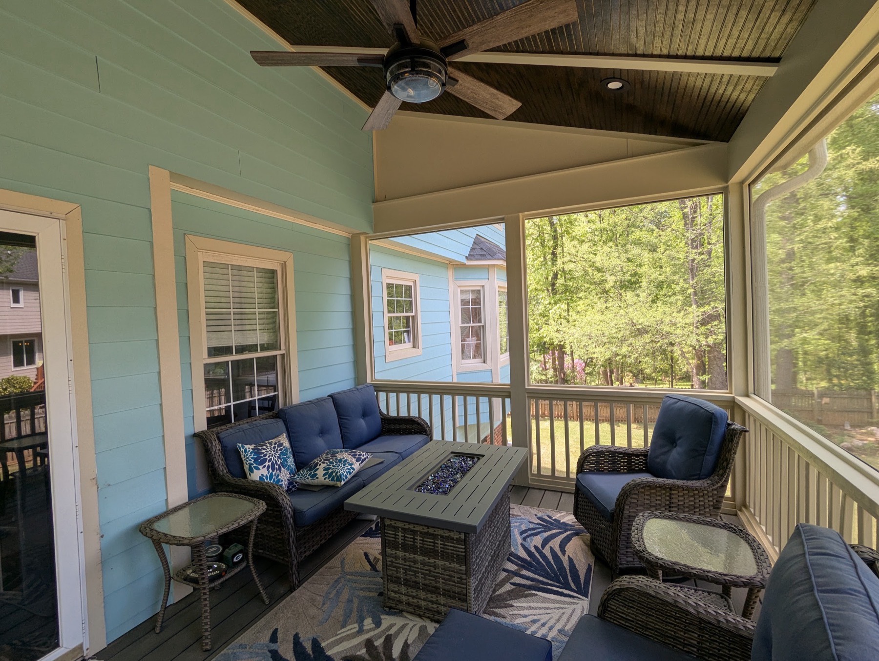 A finished screened porch — the kind of outdoor room a hardscape build makes possible.